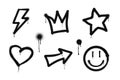 Graffiti drawing symbols set. Painted graffiti spray pattern of lightning, arrow, crown, star, heart and smile. Spray paint Royalty Free Stock Photo